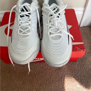 Nike White Sneakers with Black Swoosh Detail